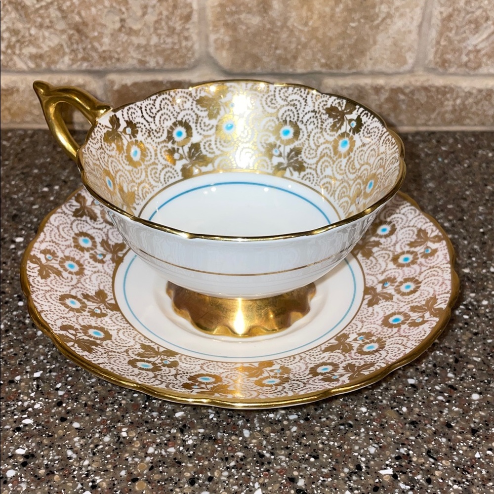 Luxurious royal stafford bone china tea cup and saucer turquoise and gold